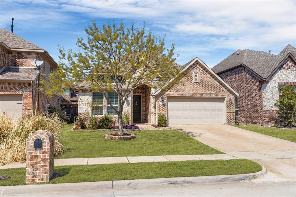 5604 Datewood Lane McKinney, TX 75071 - Photo 38 of 40 a front view of a house with garden