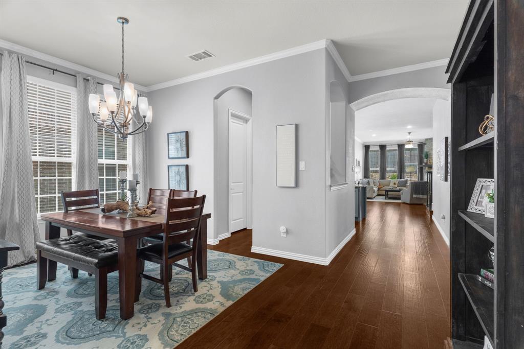 5604 Datewood Lane McKinney, TX 75071 - Photo 6 of 40 a view of a dining room with furniture window and wooden floor