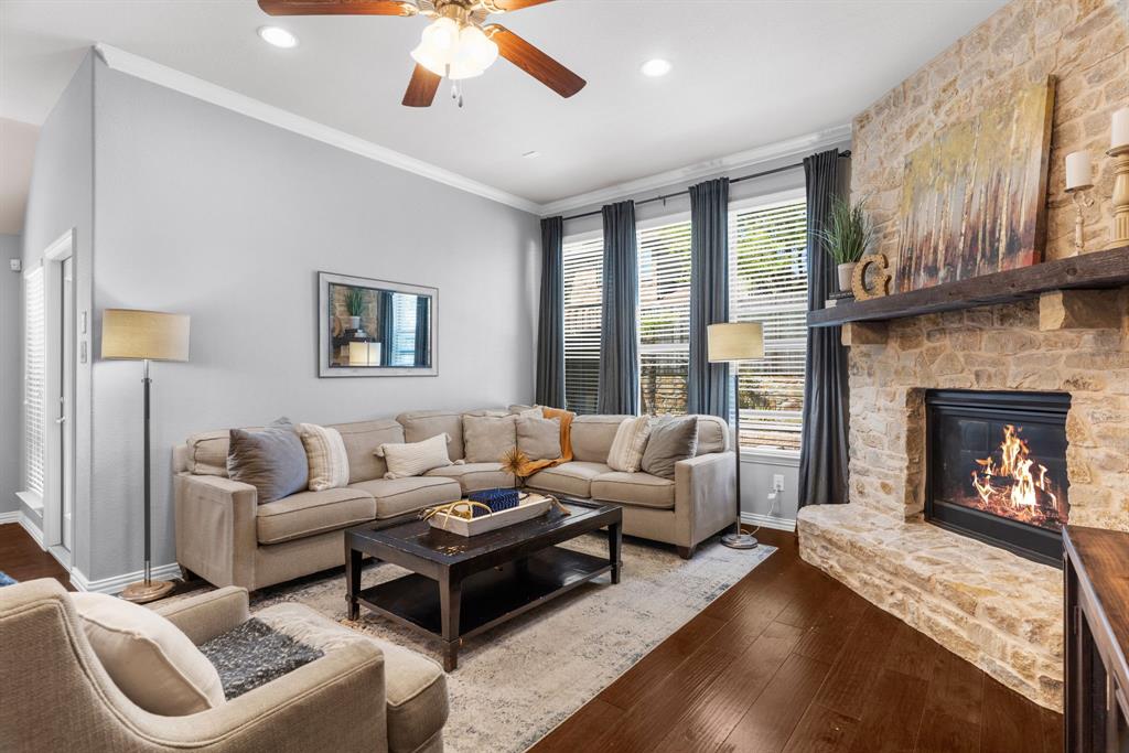 5604 Datewood Lane McKinney, TX 75071 - Photo 9 of 40 a living room with furniture and a fireplace