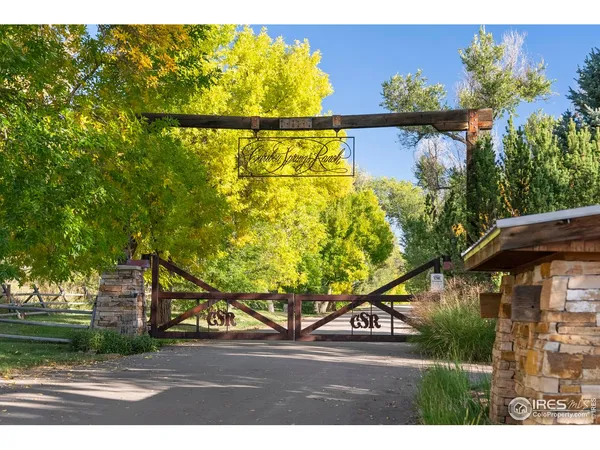 a living room with furniture a flat screen tv and a large window