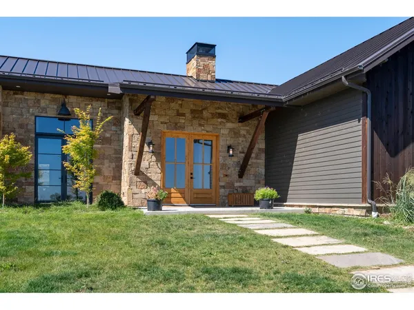 a living room with furniture a fireplace and a table