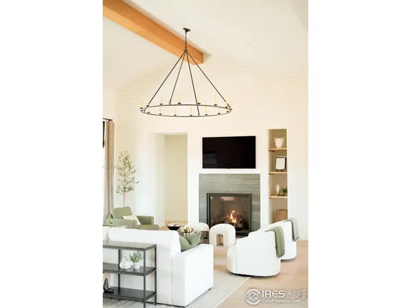 a spacious bedroom with a bed and a large window