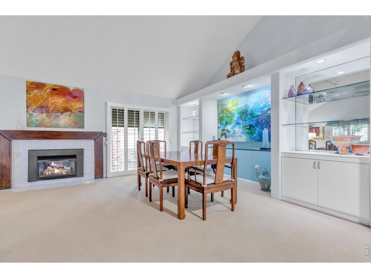 2423 Powderhorn Lane Boulder, CO 80305 - Photo 11 of 50 a dining room with furniture and a fireplace