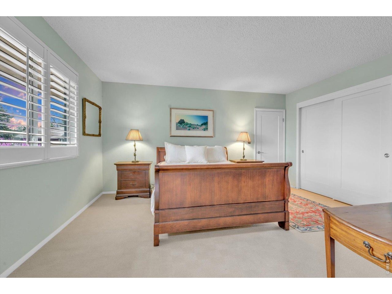 2423 Powderhorn Lane Boulder, CO 80305 - Photo 33 of 50 a bedroom with a bed and a night stand