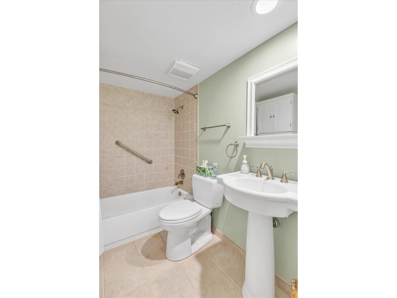 2423 Powderhorn Lane Boulder, CO 80305 - Photo 35 of 50 a bathroom with a sink toilet a mirror and shower