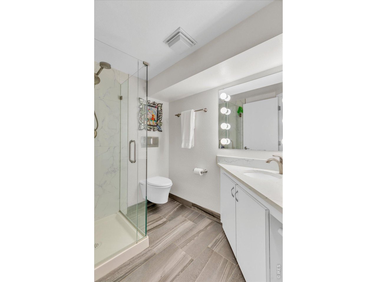 2423 Powderhorn Lane Boulder, CO 80305 - Photo 40 of 50 a spacious bathroom with a granite countertop sink a toilet and shower