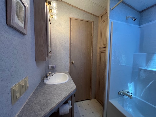 2795 East 28th Road Marseilles, IL 61341 - Photo 19 of 65 a bathroom with a granite countertop sink and mirror