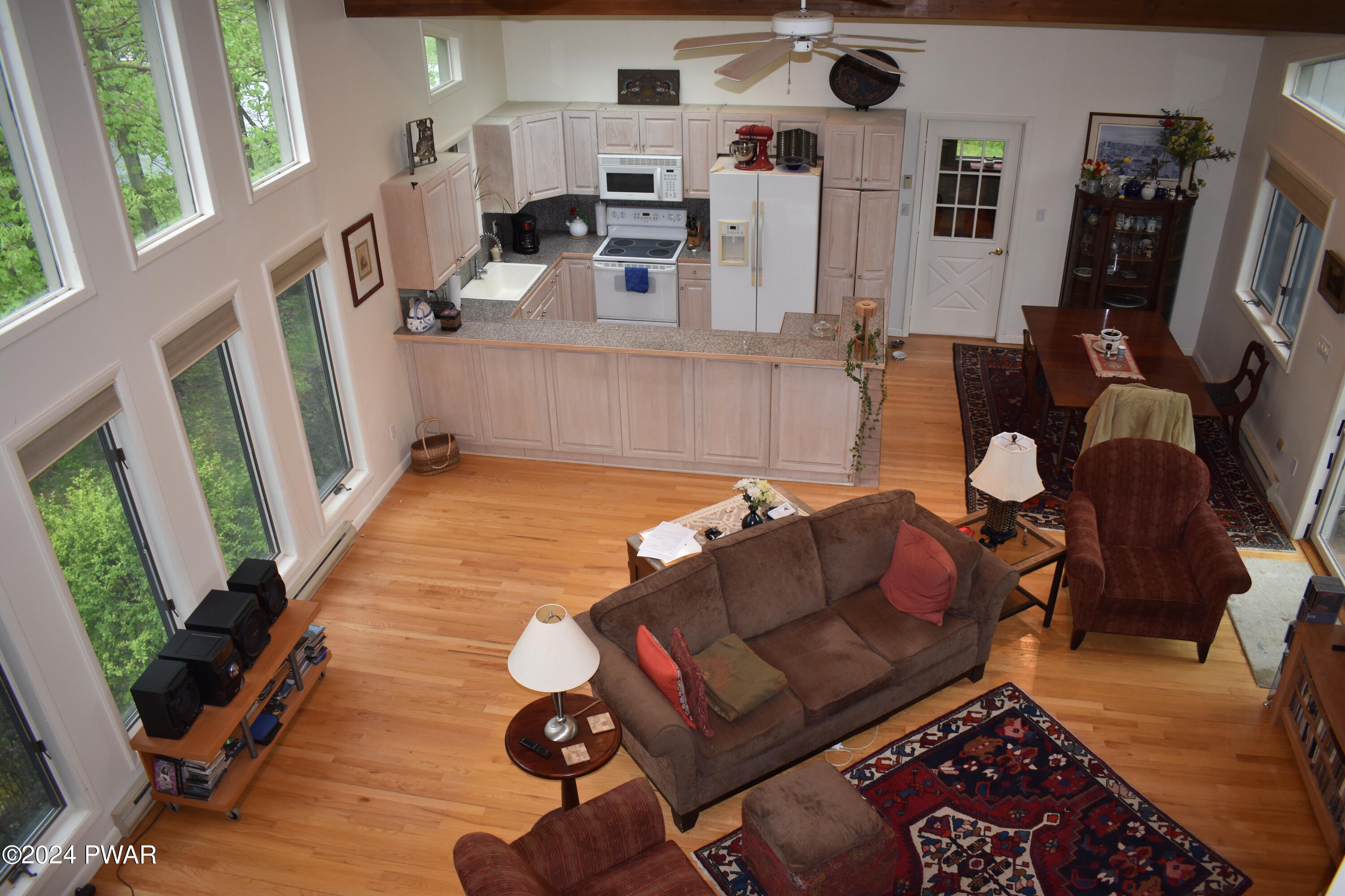 115 Rodeo Lane Hawley, PA 18428 - Photo 2 of 38 a living room with furniture rug and a large window
