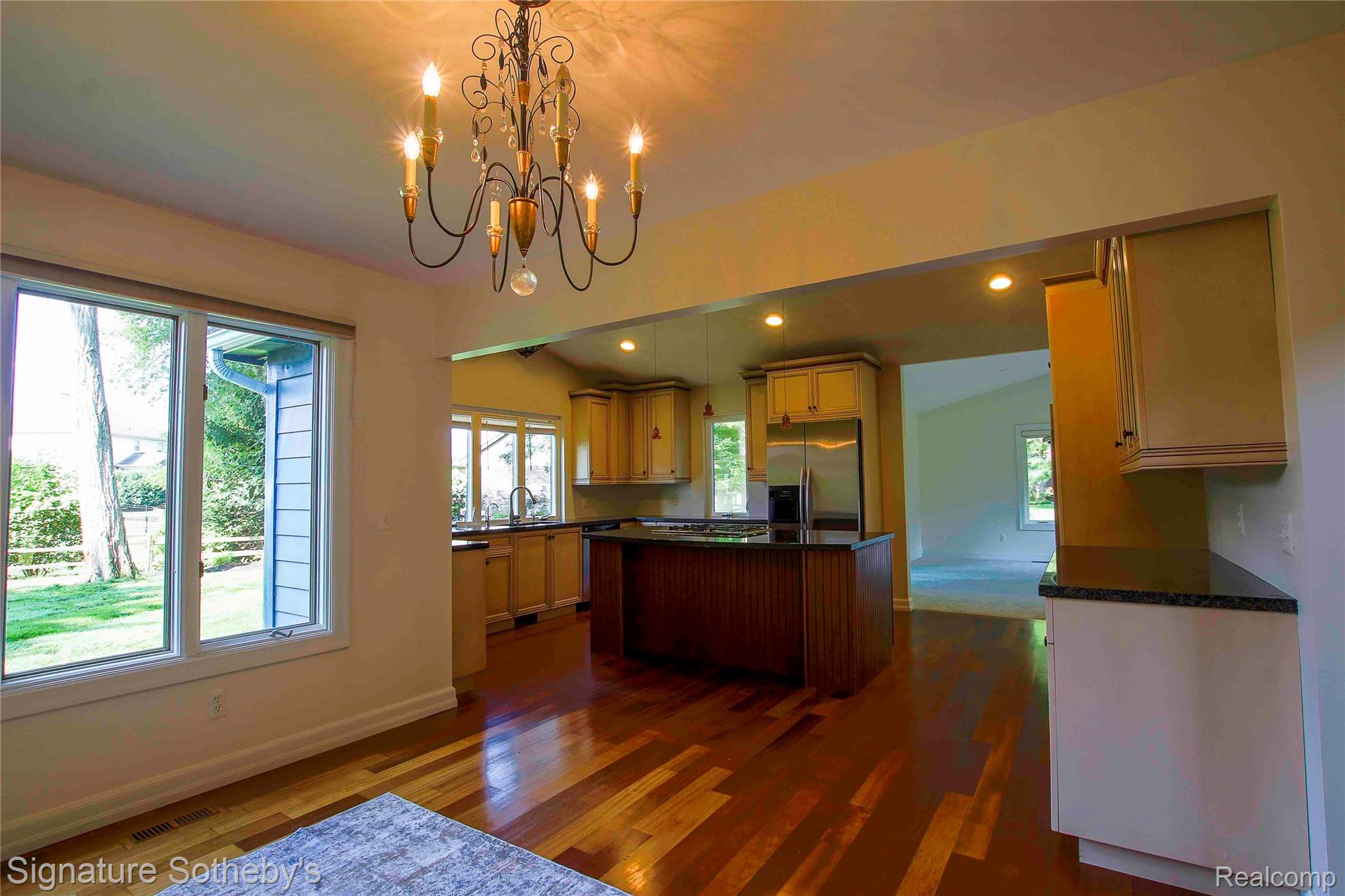 3131 Smugglers Ridge Walled Lake, MI 48390 - Photo 11 of 35 Dining space with a chandelier and large windows offering exterior views