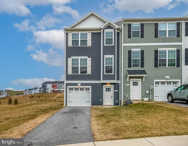 a view of a brick house with many windows