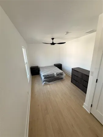 a view of room with wooden floor