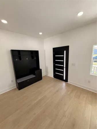 a view of an empty room with a window