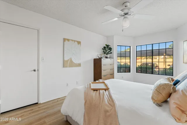 a bedroom with a bed and window