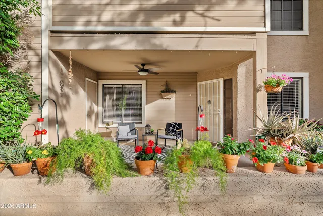 a view of a chairs and table in a patio