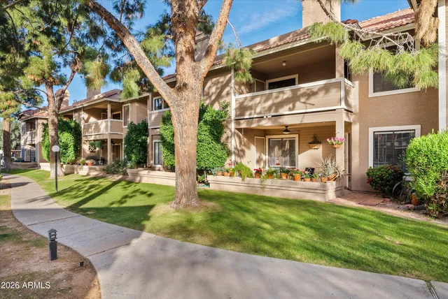 a view of a house with backyard porch and sitting area