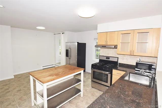 a bedroom with a bed and a cabinets