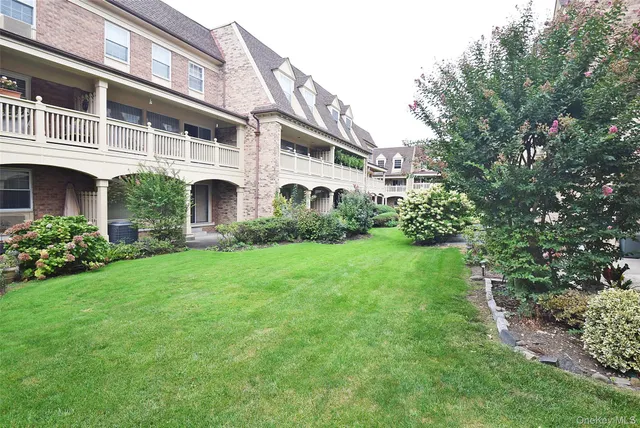 front view of a building with a yard