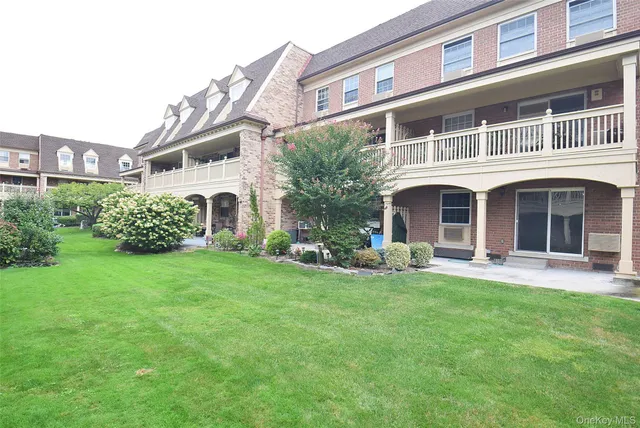 a kitchen with stainless steel appliances granite countertop a refrigerator a stove and a sink