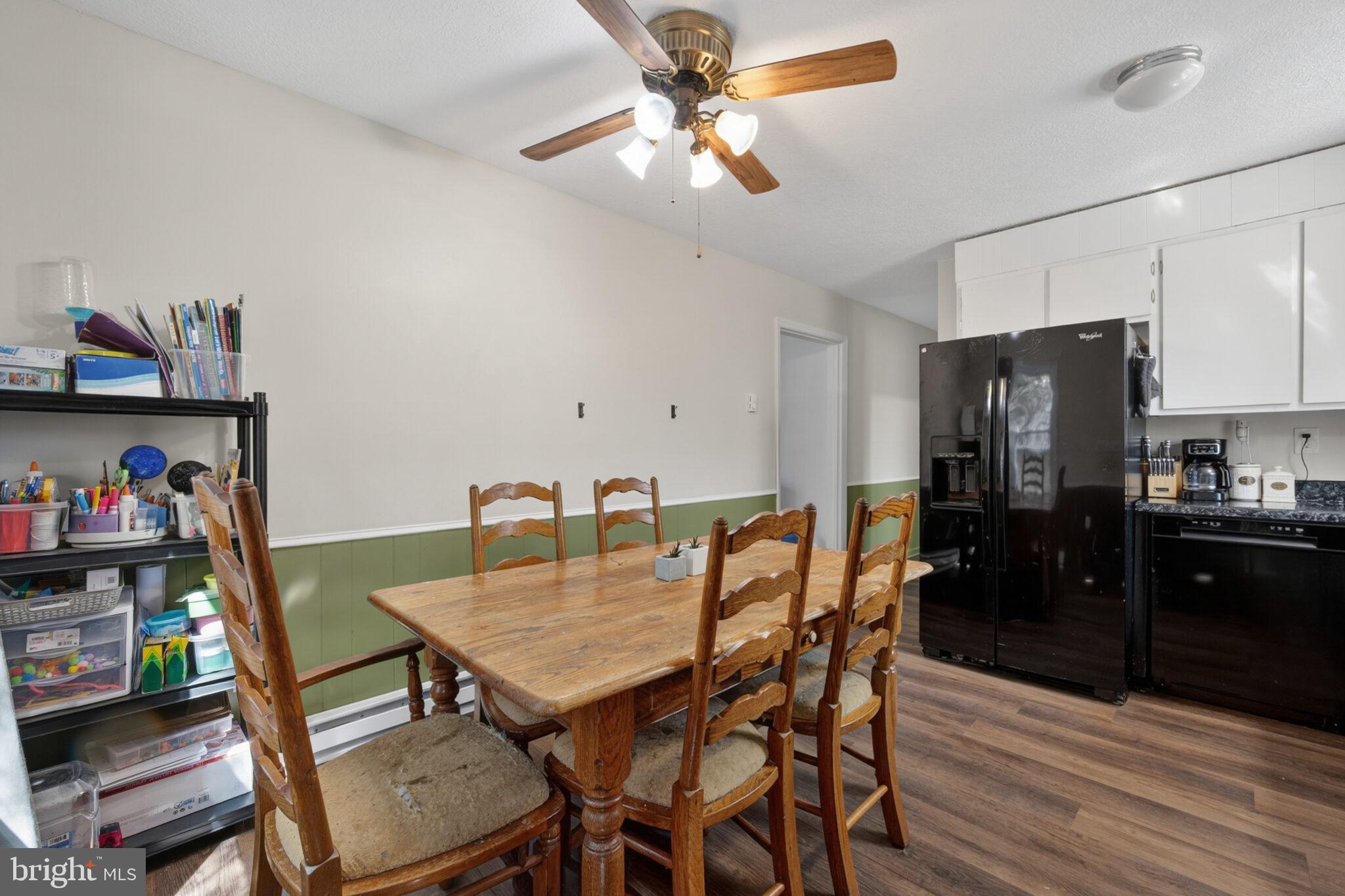 205 Monument Road Locust Grove, VA 22508 - Photo 11 of 49 a view of a dining room with furniture and wooden floor