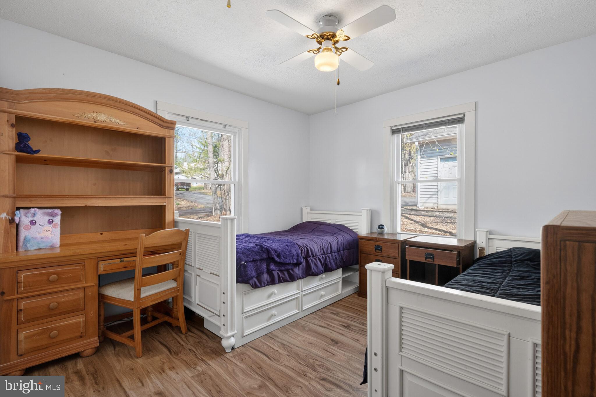 205 Monument Road Locust Grove, VA 22508 - Photo 17 of 49 a bedroom with a bed and a chandelier