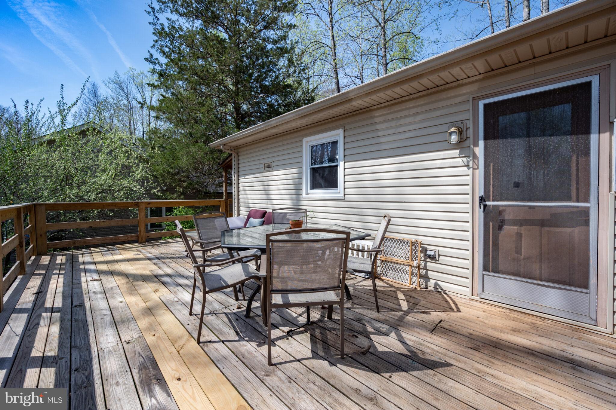 205 Monument Road Locust Grove, VA 22508 - Photo 21 of 49 a view of backyard with seating space and trees