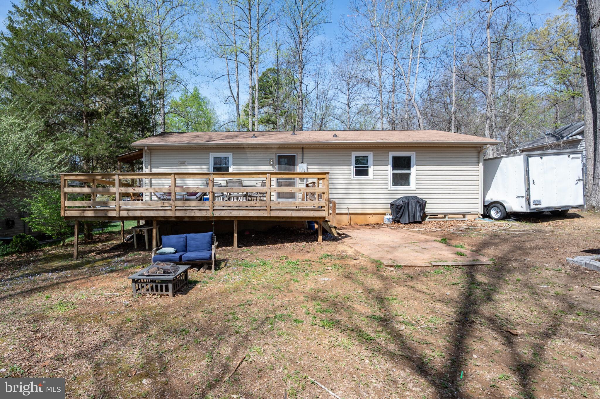 205 Monument Road Locust Grove, VA 22508 - Photo 27 of 49 a view of a house with a yard and sitting area
