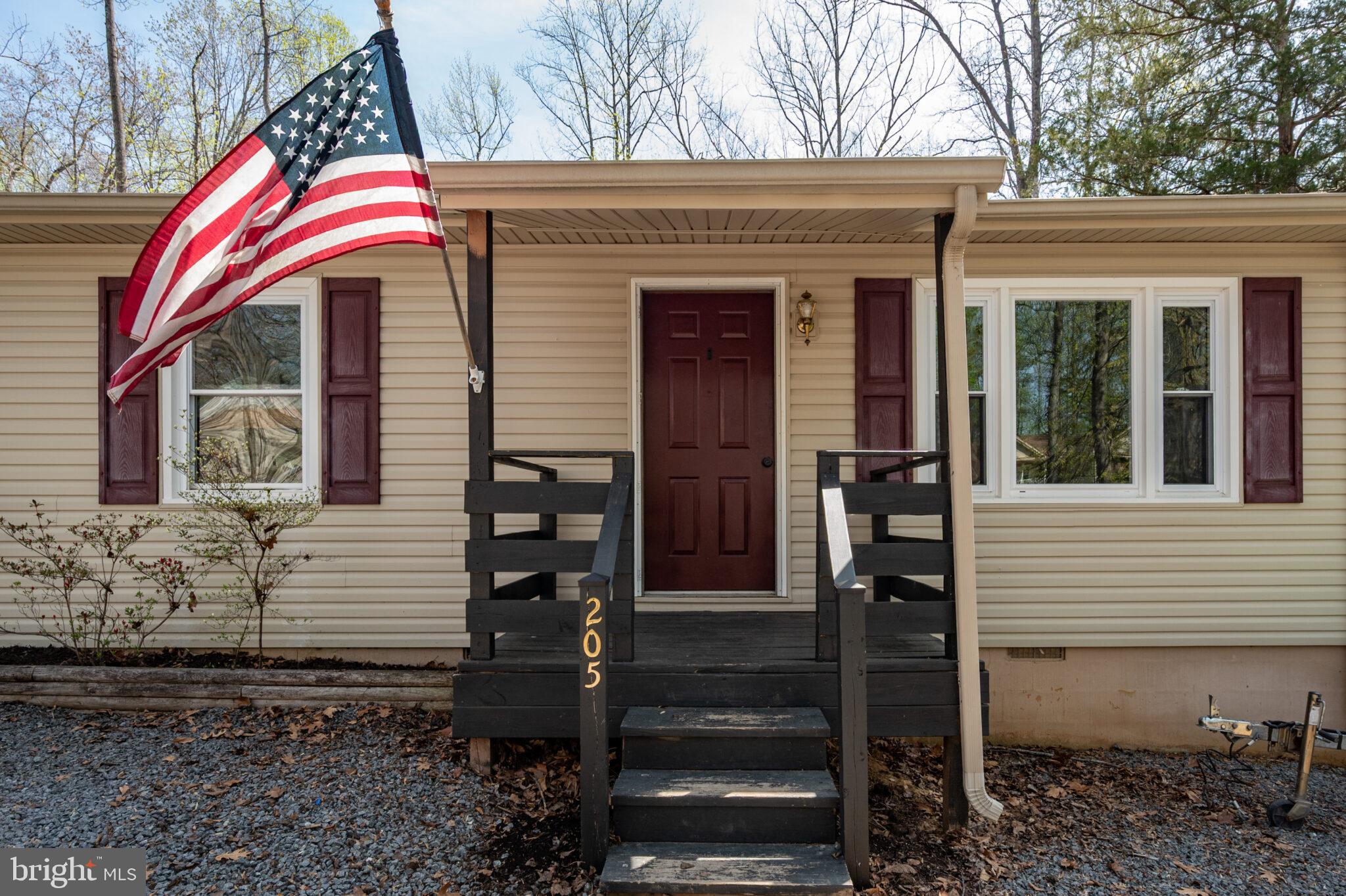 205 Monument Road Locust Grove, VA 22508 - Photo 3 of 49 a front view of a house with a yard