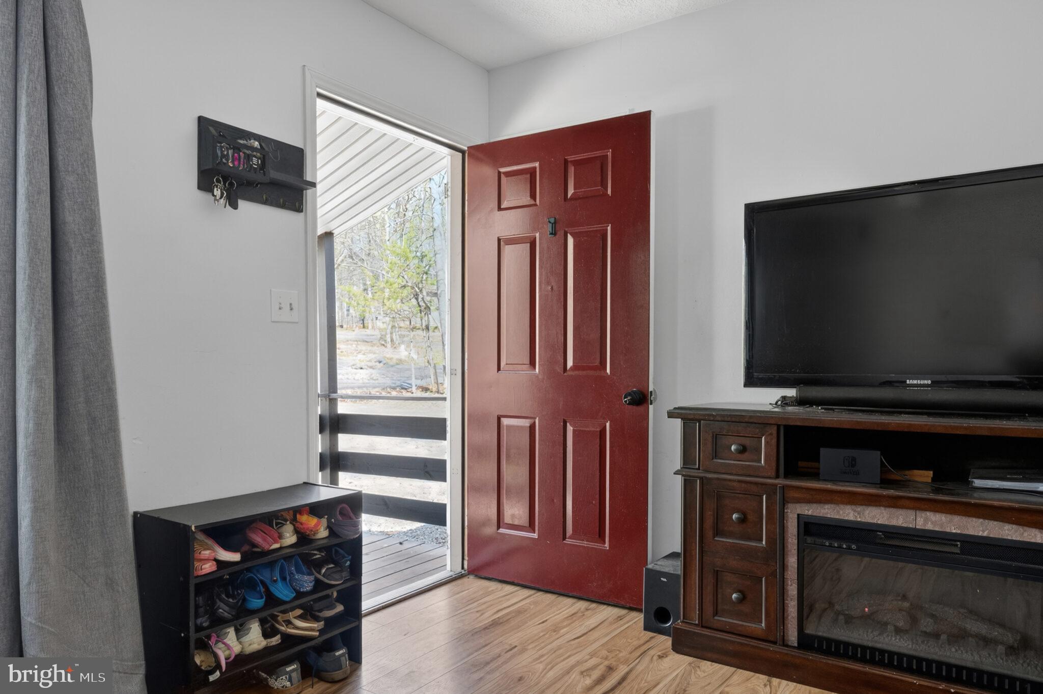 205 Monument Road Locust Grove, VA 22508 - Photo 5 of 49 a living room with furniture and a flat screen tv