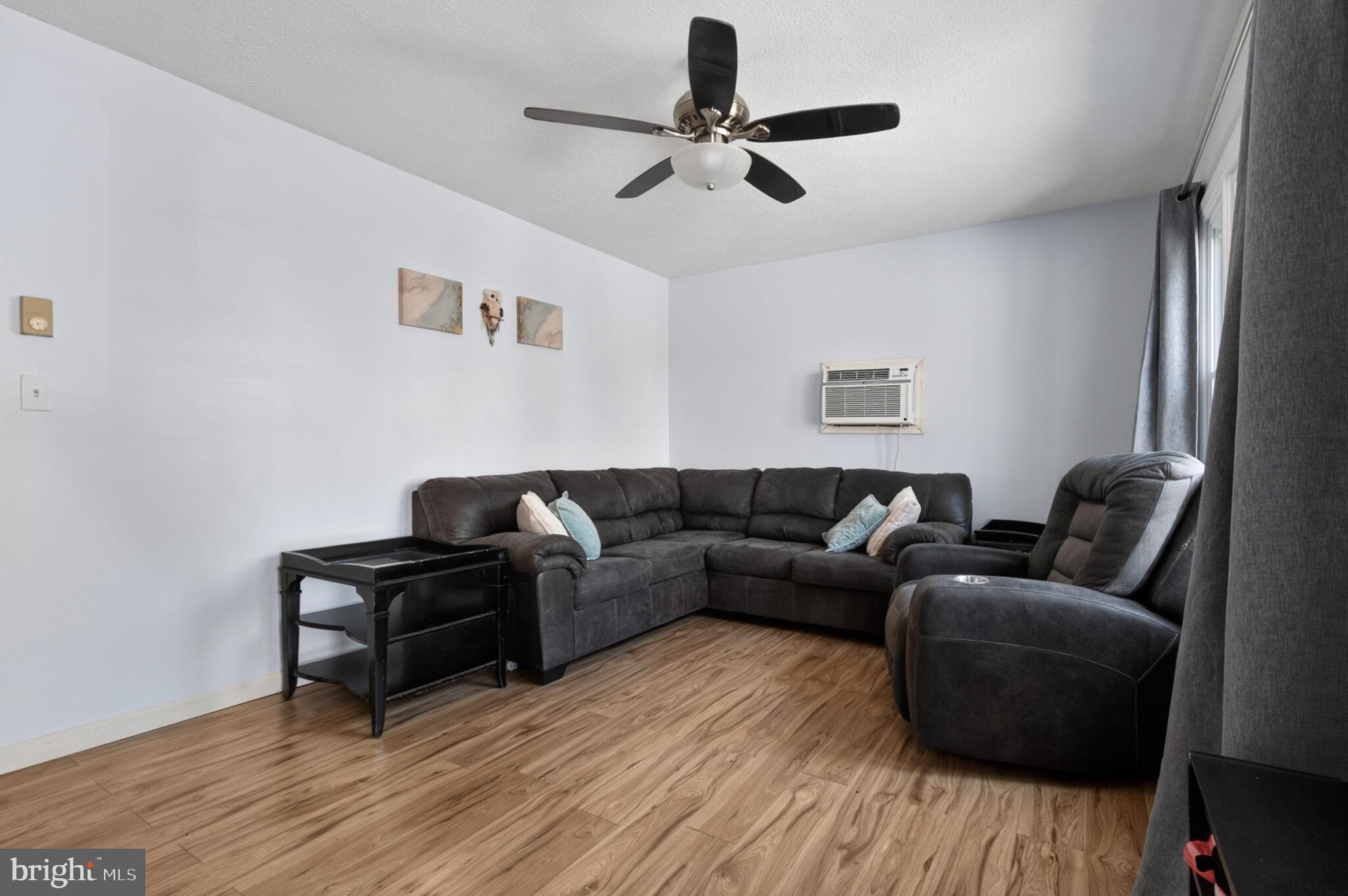 205 Monument Road Locust Grove, VA 22508 - Photo 6 of 49 a living room with furniture and a wooden floor