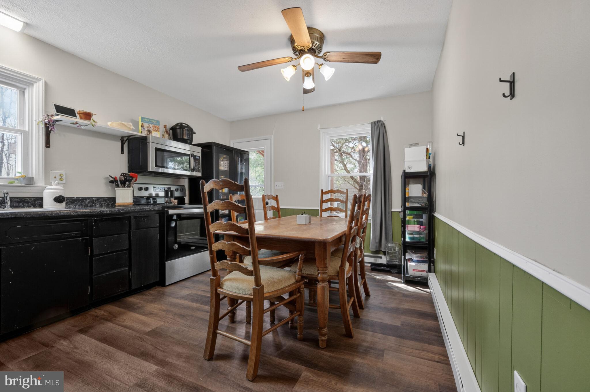 205 Monument Road Locust Grove, VA 22508 - Photo 10 of 49 a view of a dining room with furniture and chandelier