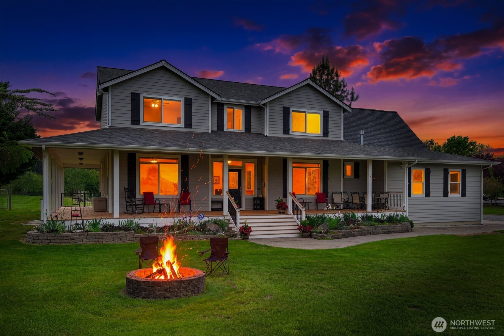 14419 Martinson Road Southeast Yelm, WA 98597 - Photo 39 of 39 a front view of a house with swimming pool and a yard