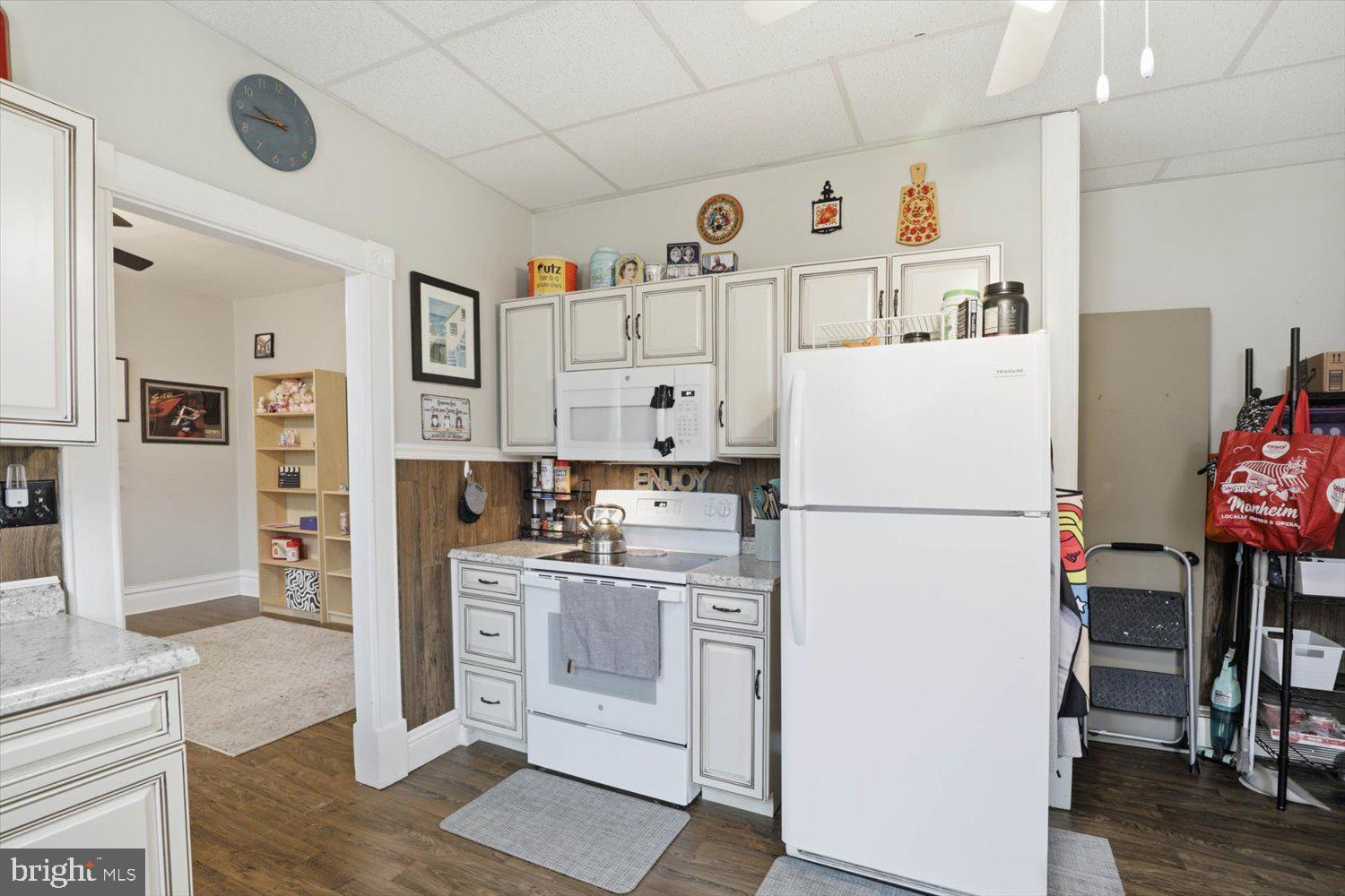 133 West High Street Manheim, PA 17545 - Photo 15 of 36 a white refrigerator freezer sitting in a kitchen