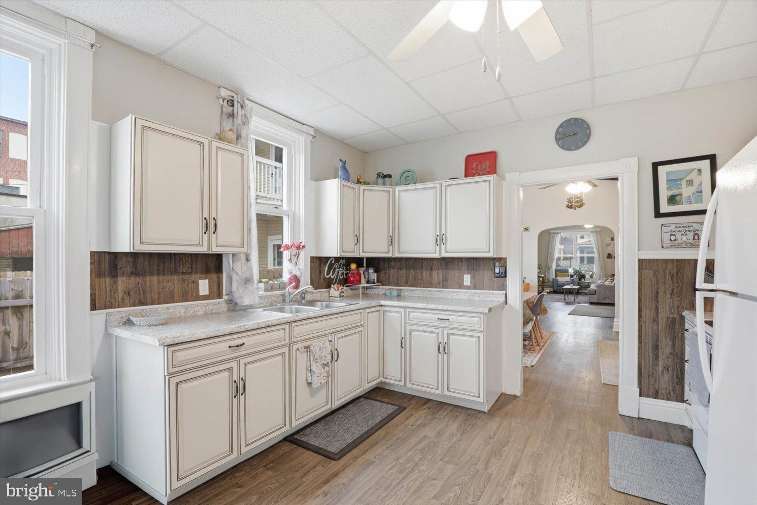 133 West High Street Manheim, PA 17545 - Photo 16 of 36 a kitchen with a sink dishwasher white cabinets and refrigerator