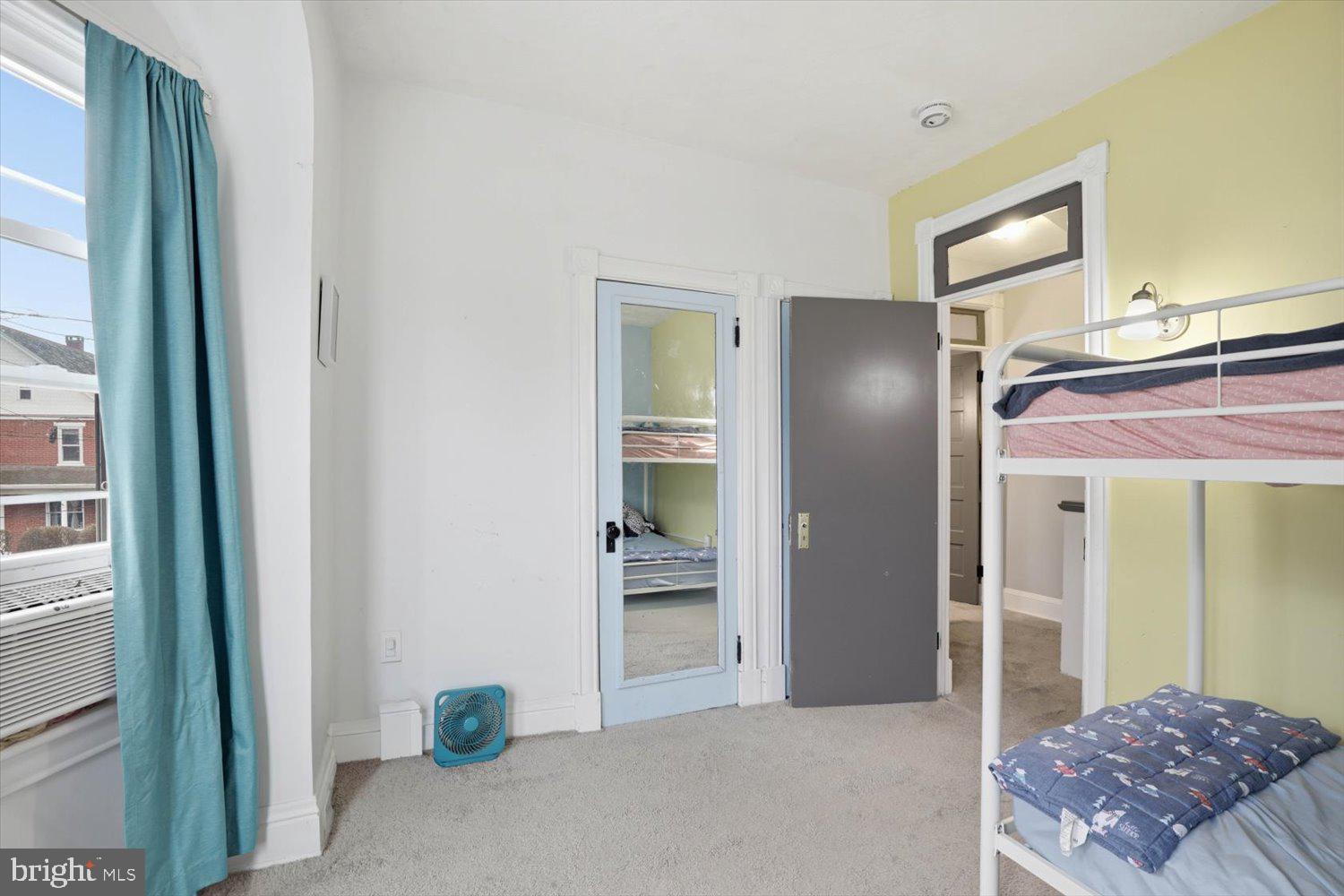 133 West High Street Manheim, PA 17545 - Photo 20 of 36 a bedroom with a bed and a mirror