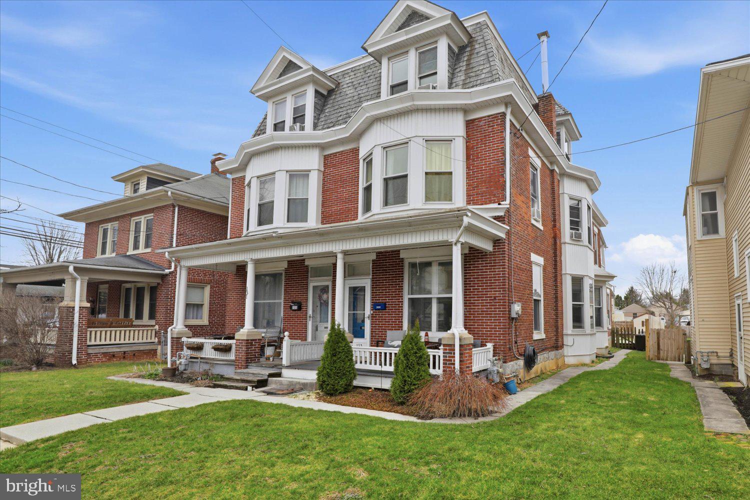 133 West High Street Manheim, PA 17545 - Photo 2 of 36 a front view of a house with a yard table and chairs