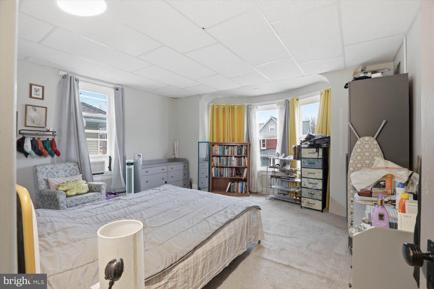 133 West High Street Manheim, PA 17545 - Photo 21 of 36 a bedroom with a bed dresser and a large window