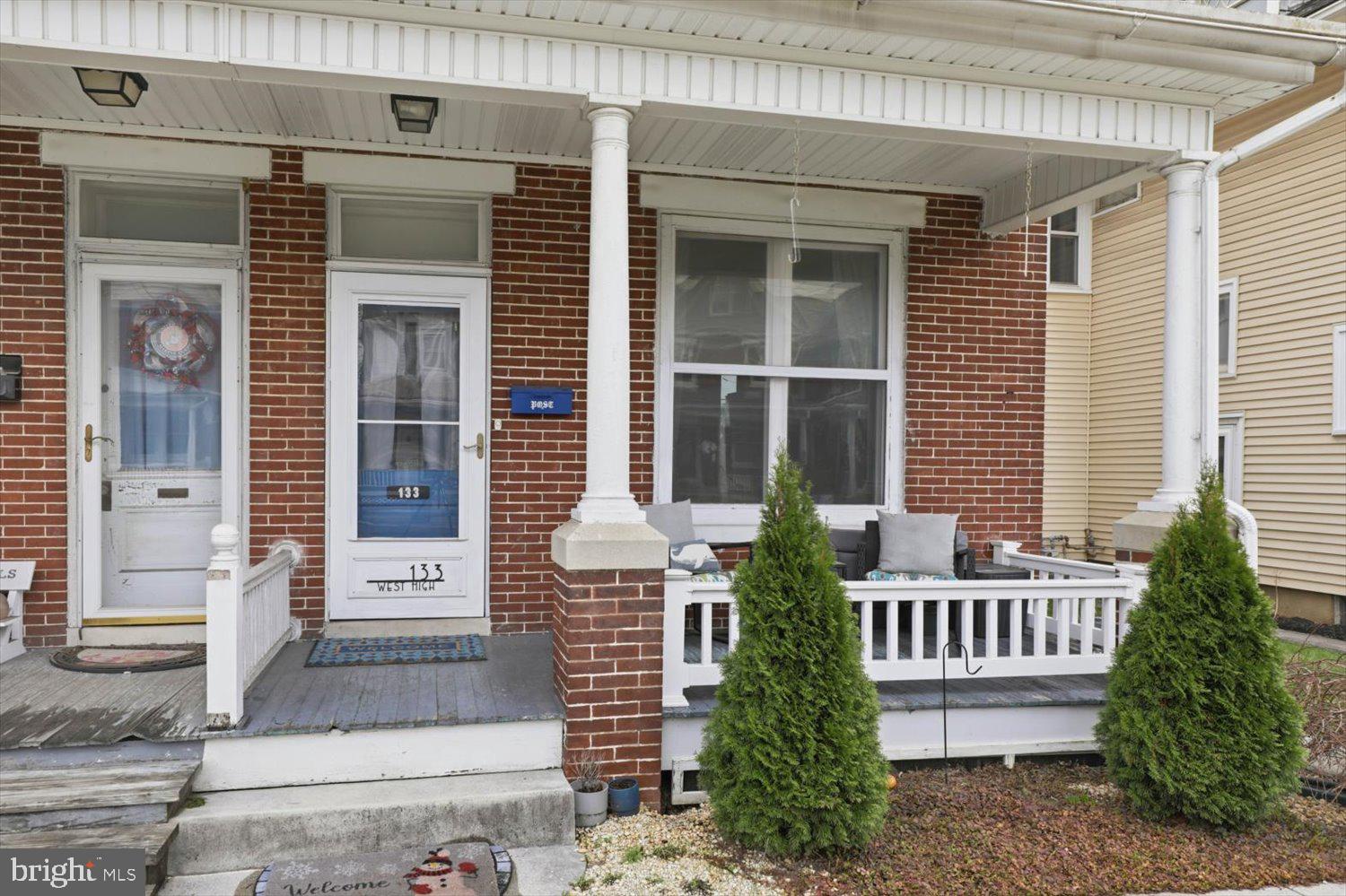133 West High Street Manheim, PA 17545 - Photo 3 of 36 a front view of a house with plants