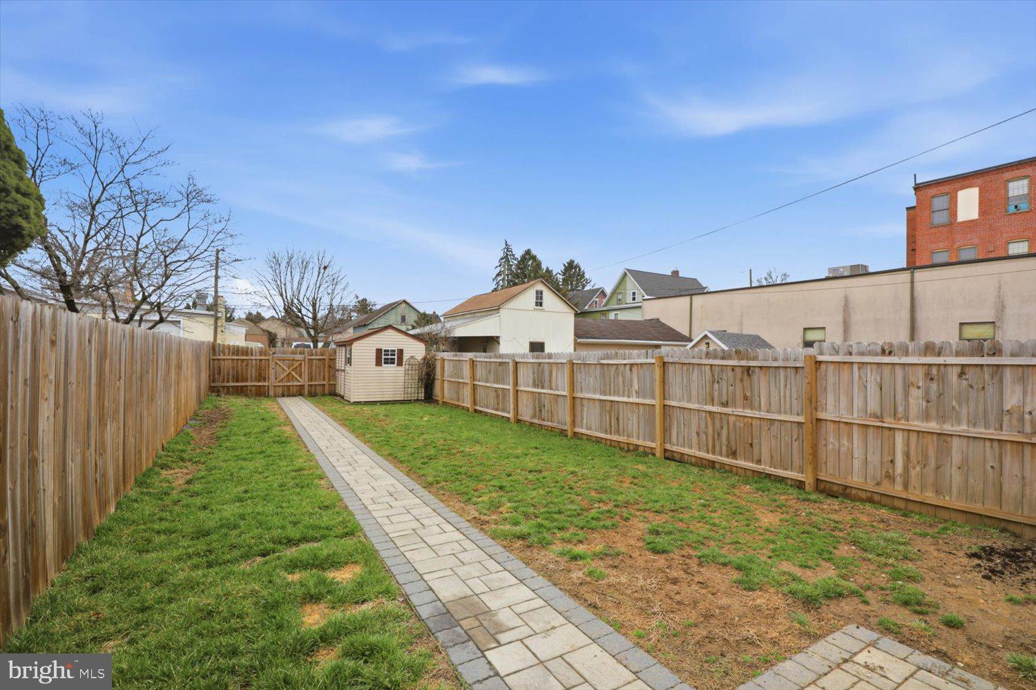 133 West High Street Manheim, PA 17545 - Photo 32 of 36 a view of a backyard with wooden fence