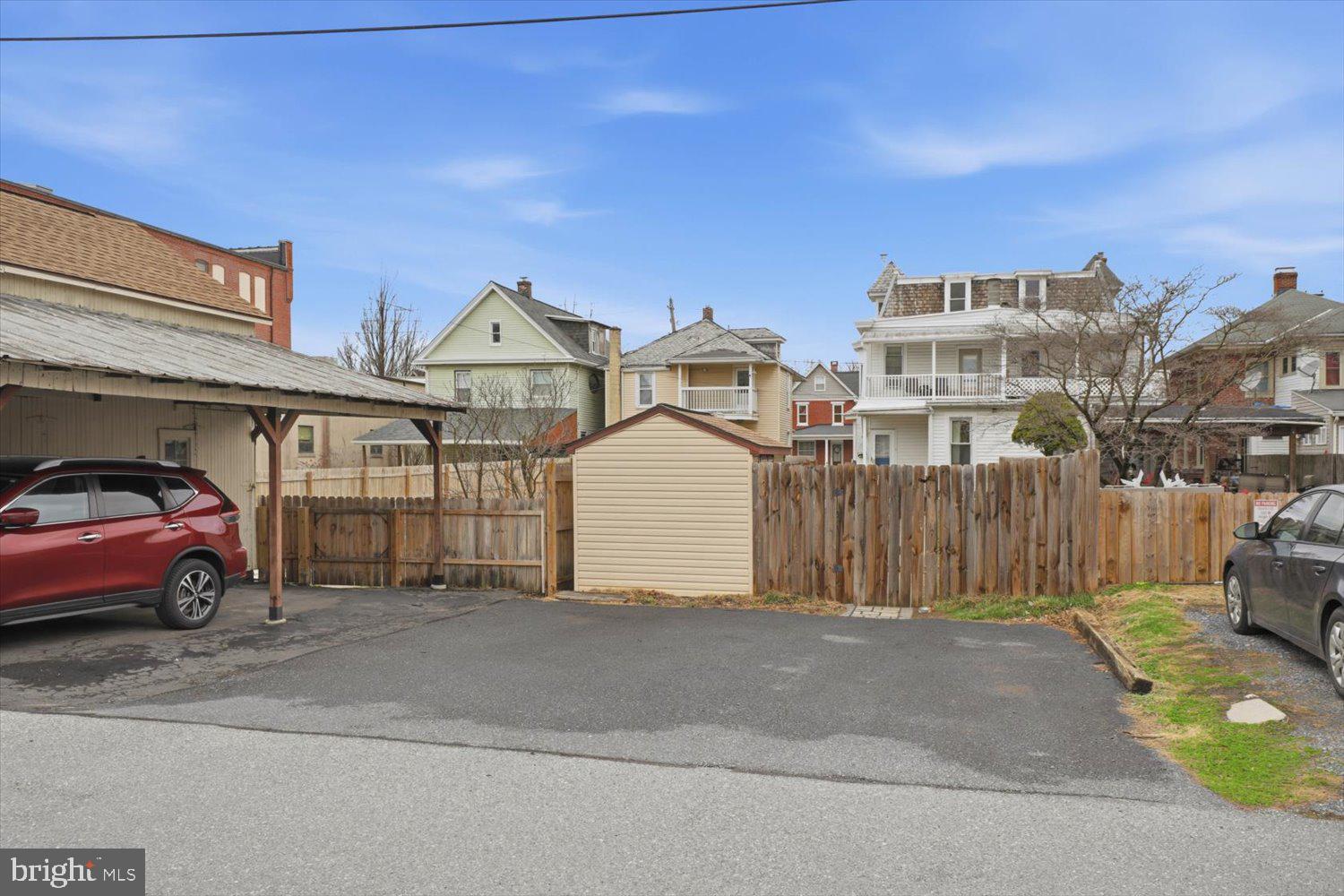 133 West High Street Manheim, PA 17545 - Photo 35 of 36 a front view of a house with a garden and parking space