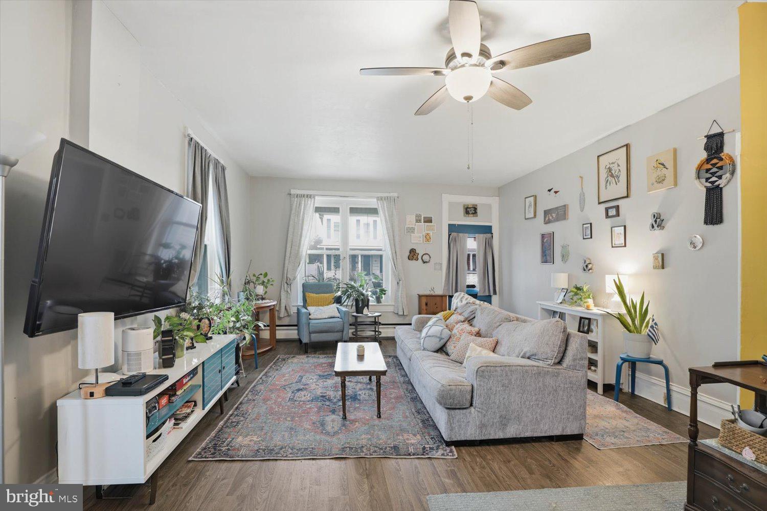133 West High Street Manheim, PA 17545 - Photo 6 of 36 a living room with furniture and a flat screen tv