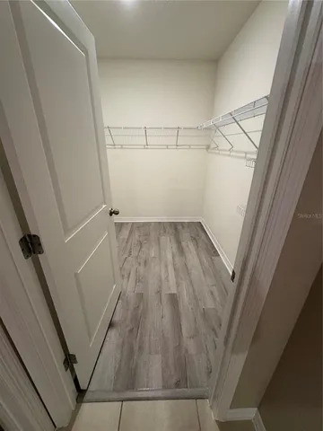 a view of an empty walk in closet