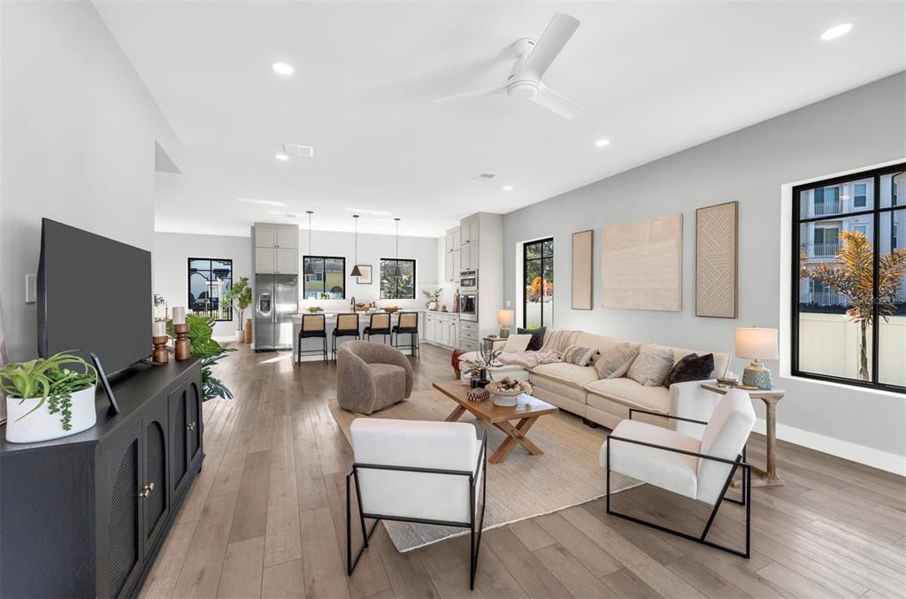 529 West Princeton Street Orlando, FL 32804 - Photo 22 of 50 a living room with furniture wooden floor and a flat screen tv