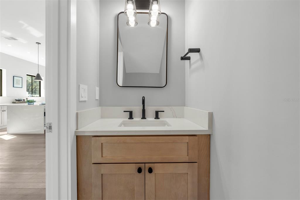 529 West Princeton Street Orlando, FL 32804 - Photo 29 of 50 a bathroom with a sink vanity and a mirror