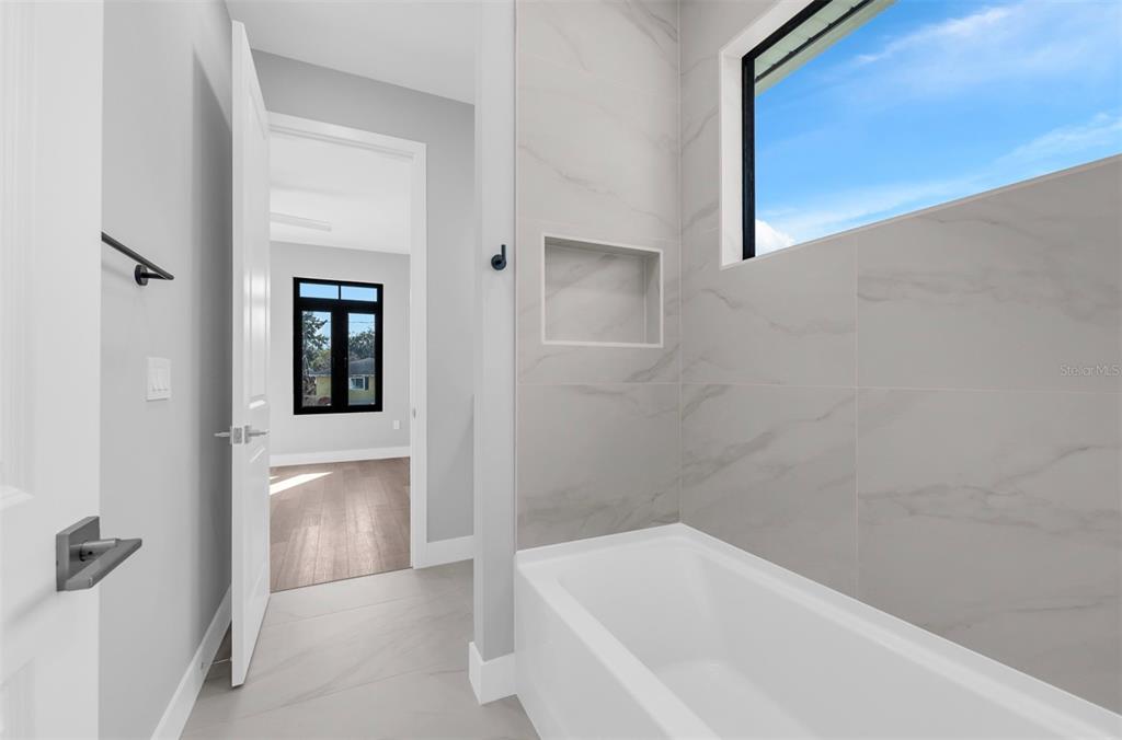 529 West Princeton Street Orlando, FL 32804 - Photo 40 of 50 a bathroom with a bathtub and shower
