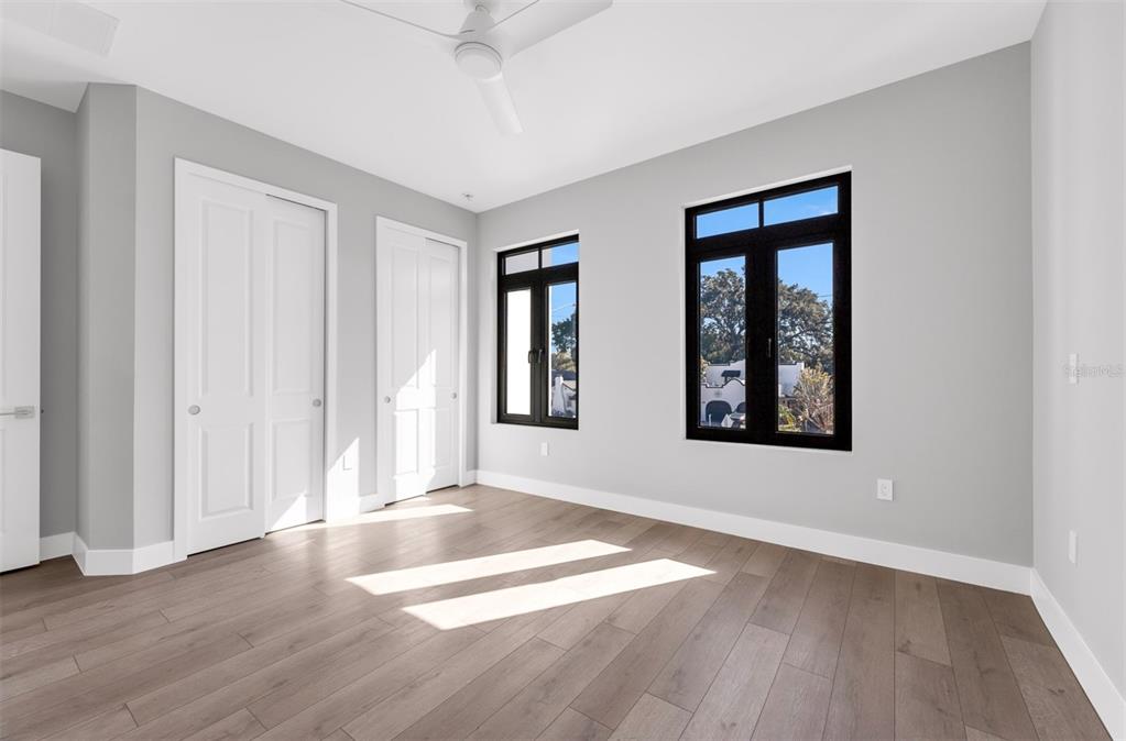 529 West Princeton Street Orlando, FL 32804 - Photo 42 of 50 an empty room with wooden floor and windows