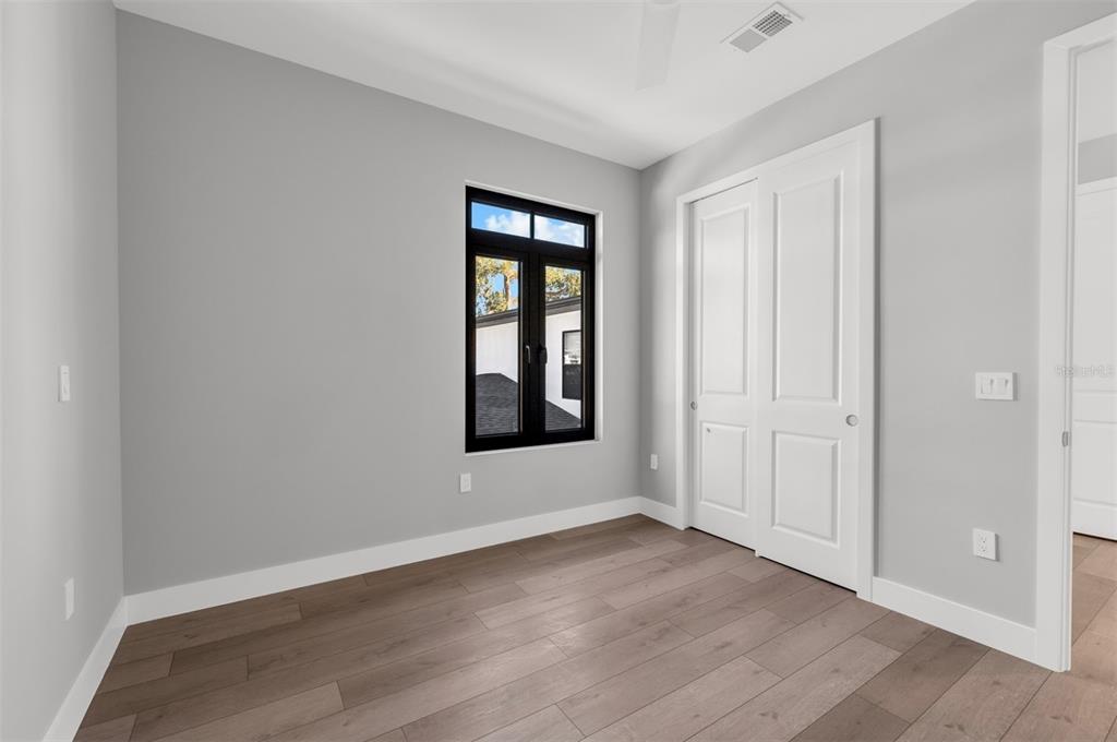 529 West Princeton Street Orlando, FL 32804 - Photo 45 of 50 an empty room with wooden floor and windows