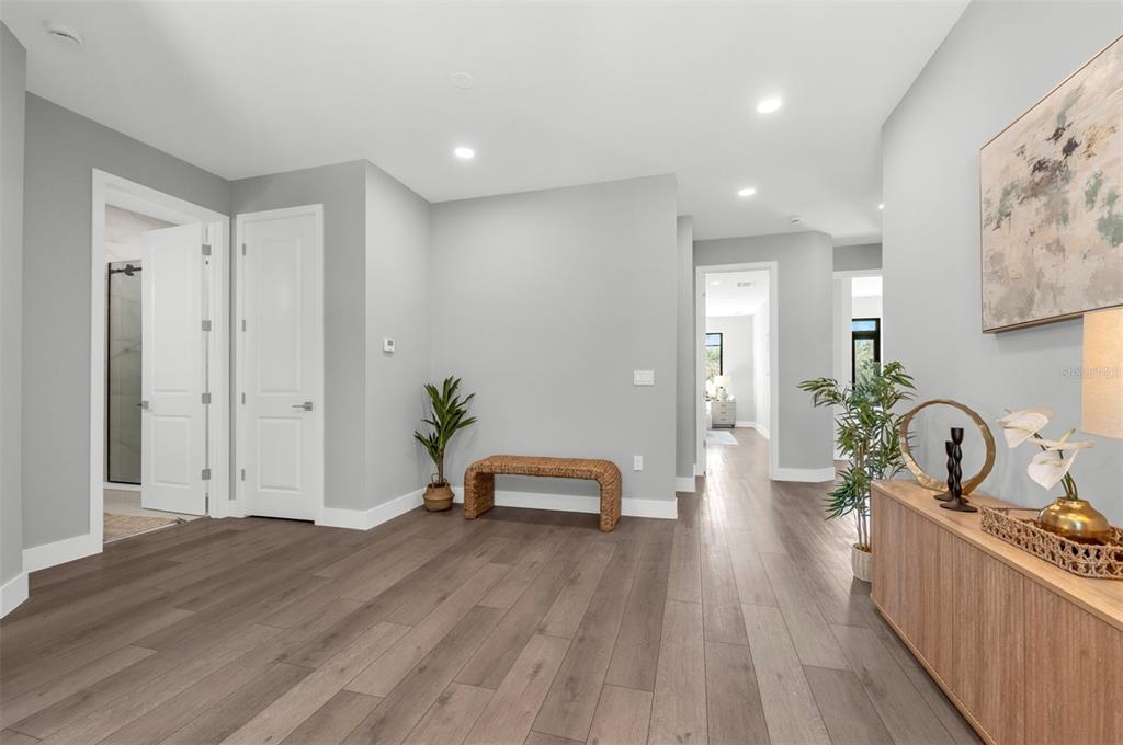 529 West Princeton Street Orlando, FL 32804 - Photo 48 of 50 a view of a hallway with wooden floor and furniture