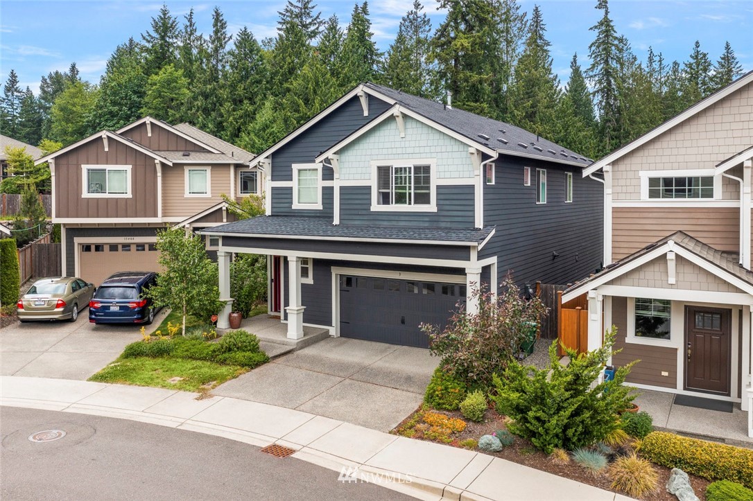 3 159th Place Southeast Bothell, WA 98012 - Photo 22 of 27 a front view of a house with a yard and garage