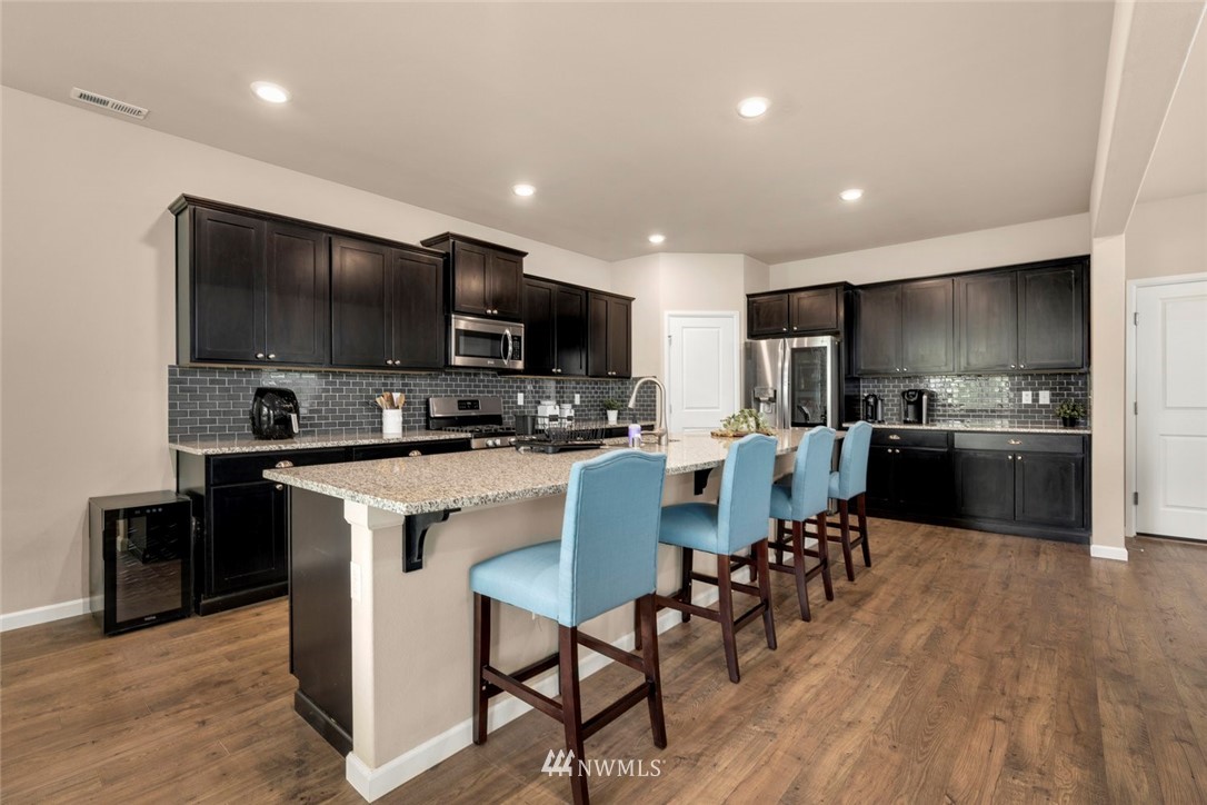 3 159th Place Southeast Bothell, WA 98012 - Photo 5 of 27 a kitchen with a sink stainless steel appliances and cabinets