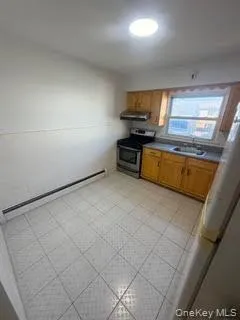 a kitchen with microwave and cabinets